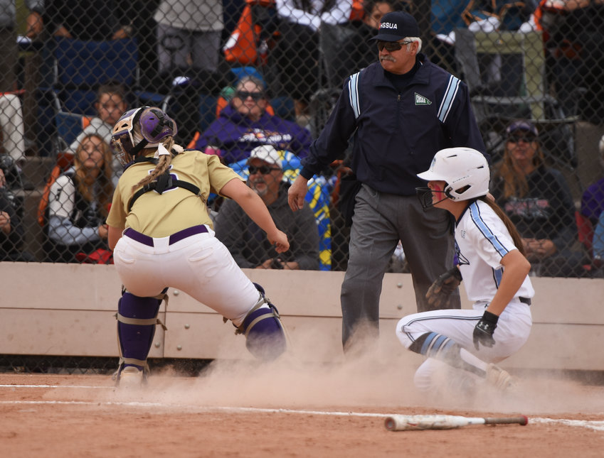 Riverdale Ridge's Madyson Ortiz scores the tying run in the top of the fourth inning against Holy Family in a CHSAA 4A semifinal game at Aurora Sports Park Oct. 23. This was the Ravens' last run, as they were defeated by the Tigers 7-3.